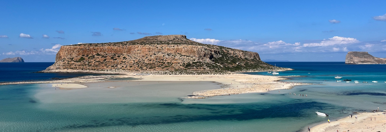 single-wandelreis-kreta-west-header turkooise zee met eiland op kreta